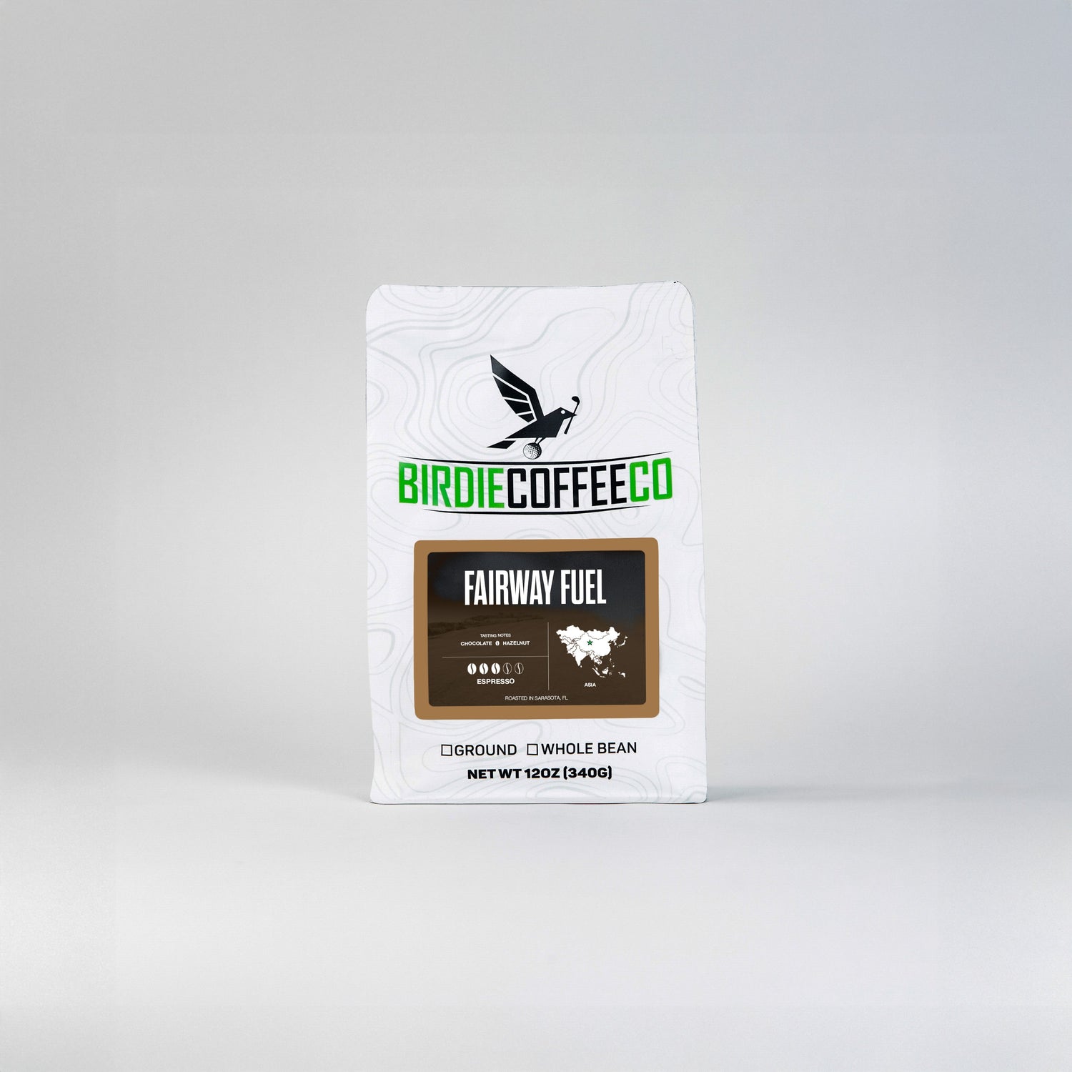 Medium roast Fairway Fuel coffee bag from Birdie Coffee Company with vibrant label, showcasing rich coffee beans and branding details.