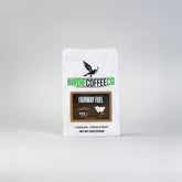 Ground Fairway Fuel Medium Roast Coffee by Birdie Coffee Company, showcasing rich coffee grounds in a clear container.