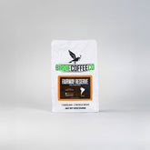 Ground Colombia coffee from Fairway Reserve by Birdie Coffee Company, showcasing rich, aromatic coffee grounds in a clear container.