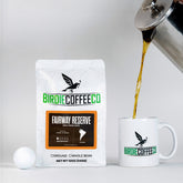Ground Colombia coffee from Fairway Reserve by Birdie Coffee Company, showcasing rich, roasted coffee grounds in a clear bag.