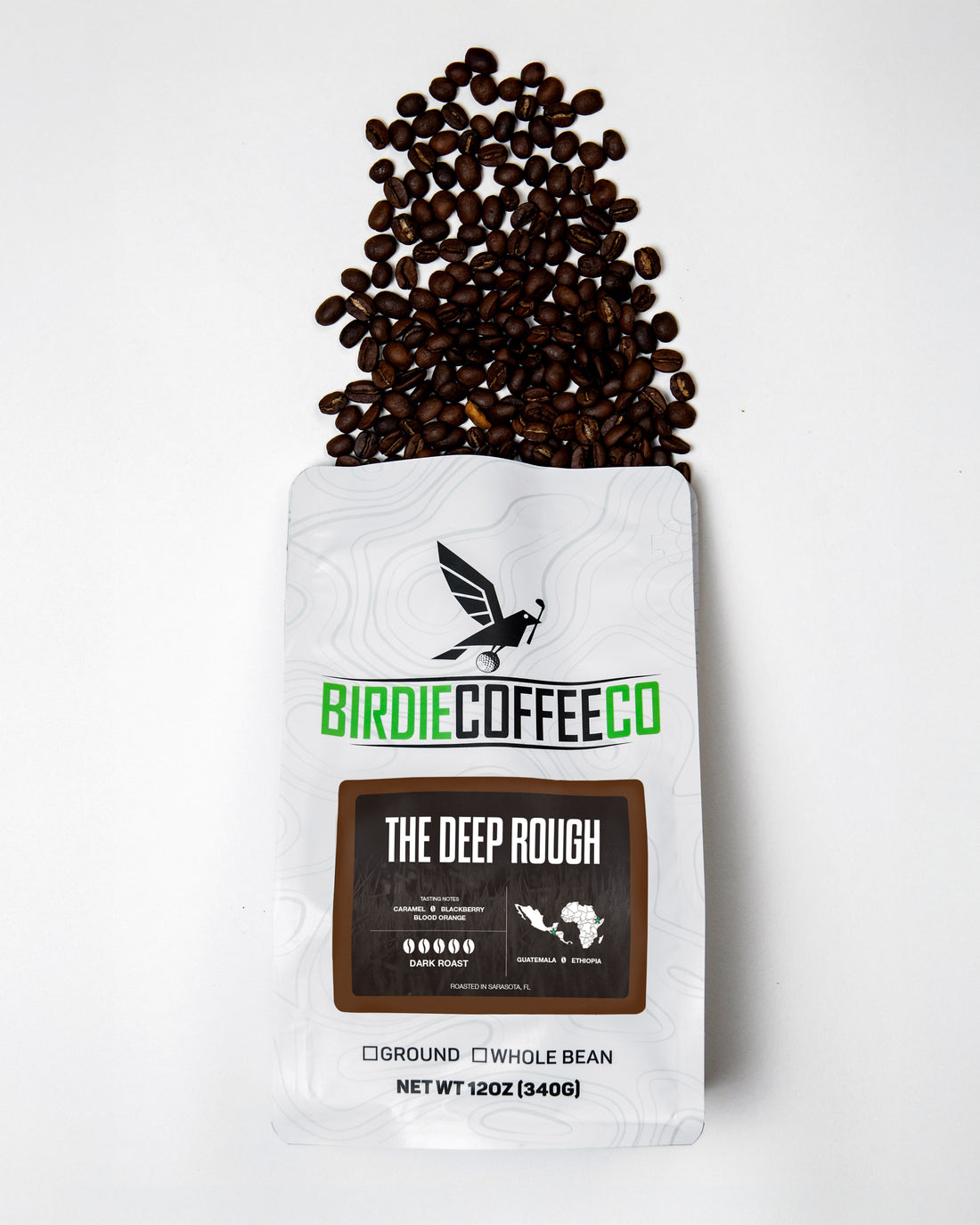 Dark roast coffee bag labeled The Deep Rough from Birdie Coffee Company, showing rich, dark beans and packaging design.
