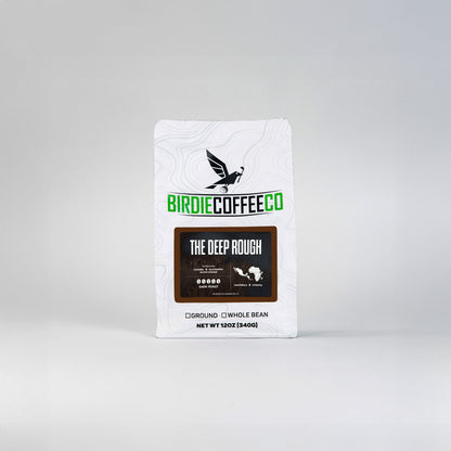 Dark roast coffee in a bag from Birdie Coffee Company, featuring The Deep Rough blend with rich, bold coffee beans.