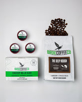 Ground dark roast coffee from Birdie Coffee Company, The Deep Rough blend, with rich, deep-brewed aroma and deep brown color.