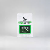 Ground Birdie Coffee Company The First Cut Medium Roast Coffee in a bag, showing rich brown coffee grounds.