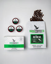 Ground Birdie Coffee Company The First Cut Medium Roast Coffee in a jar, showcasing rich, aromatic coffee grounds.