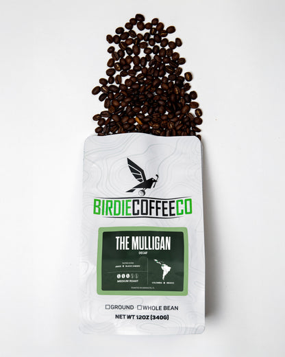 Decaf coffee bag labeled The Mulligan from Birdie Coffee Company, featuring a rustic coffee bag with branding and label details.