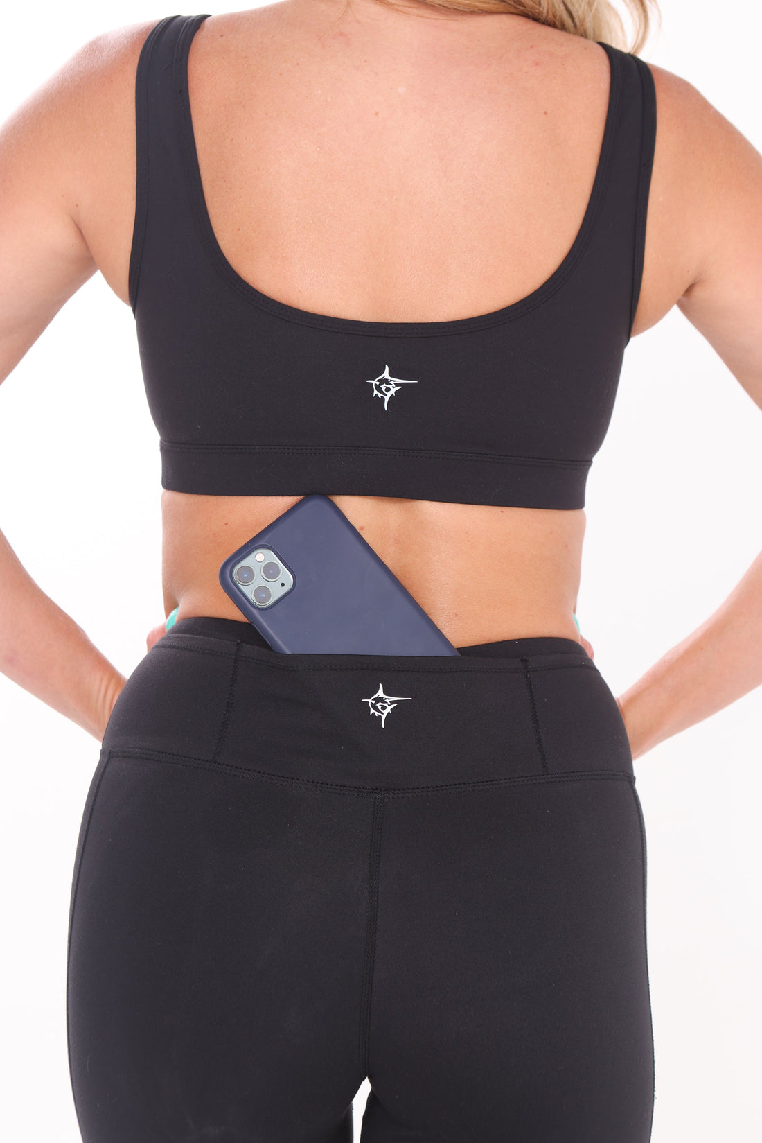 Black HydroFlex Cut Out Leggings by White Water Life featuring mesh panels and a sleek, athletic fit for active wear.