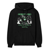 Yūjin Clothing Grinchy Vibes Christmas hoodie featuring a festive green Grinch design on cozy, holiday-themed hoodie fabric.