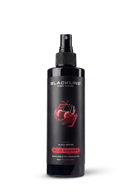 Blackline Car Care Blackline® 8oz Wild Cherry car air freshener hanging in a vehicle interior.