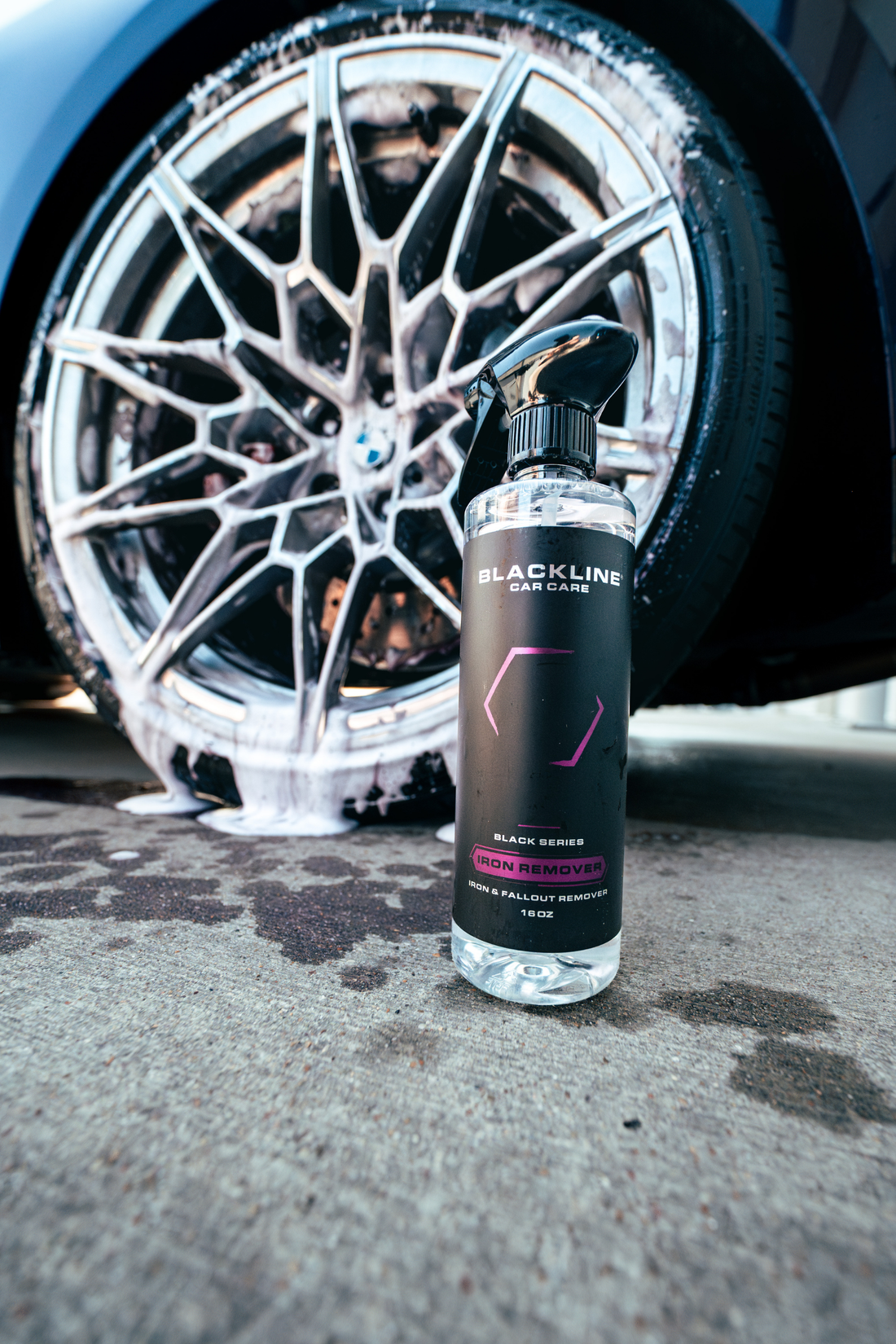 Blackline Car Care Iron Remover bottle with spray nozzle, designed for cleaning car paint by removing iron contaminants.