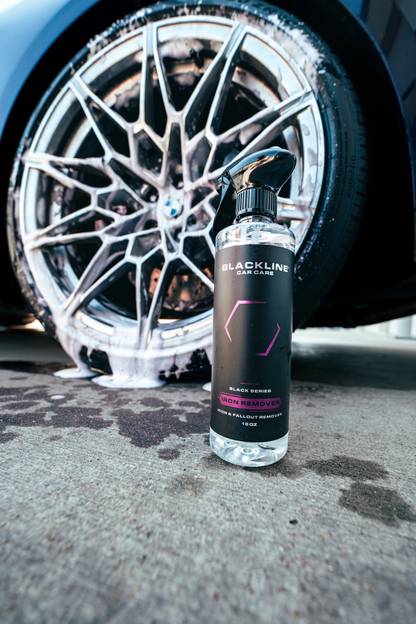 Blackline Car Care Iron Remover bottle with spray nozzle, designed for cleaning car paint by removing iron contaminants.