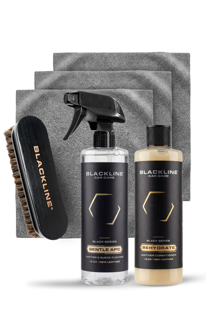 Blackline Car Care BLACKLINE® Rehydrate Leather Conditioner applied with a leather brush, restoring and conditioning vehicle leather surfaces.