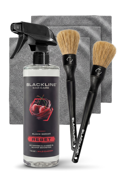 Blackline Car Care BLACKLINE® Reset Interior Cleaner and Scent Booster, cherry-scented, in a spray bottle for vehicle interior cleaning.