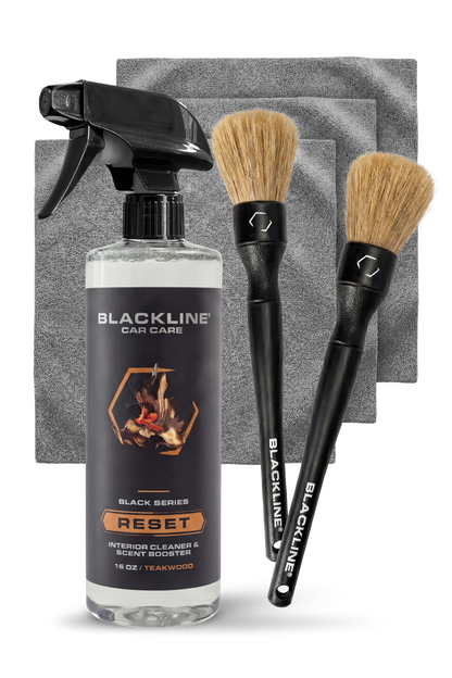 Blackline Car Care BLACKLINE® Reset Interior Cleaner and Scent Booster with teakwood scent in a bottle.