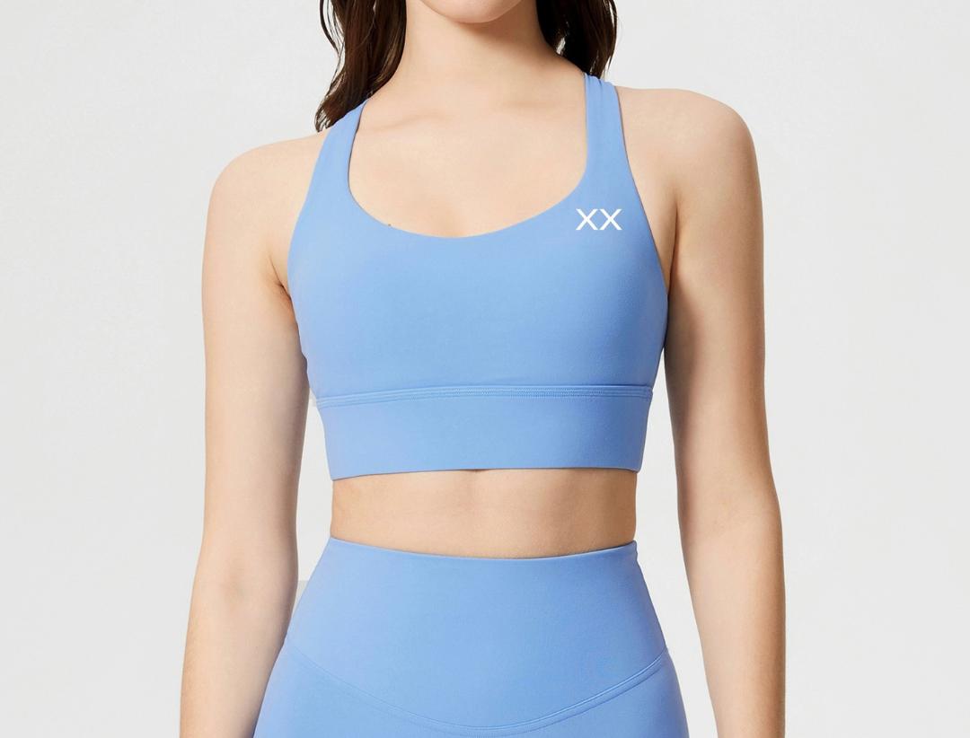 BLACKOUT BARBELL Ryla bra with supportive design and adjustable straps, displayed on a neutral background.