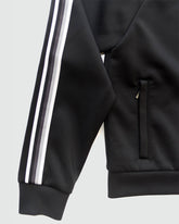 Goal Five Powerstripe LS Track Jacket in black, featuring a sleek lifestyle design with stripe details and athletic fit.
