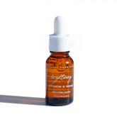 Pretty Farm Girl brightening face serum with vitamin C, featuring a clear glass bottle and dropper for skincare.