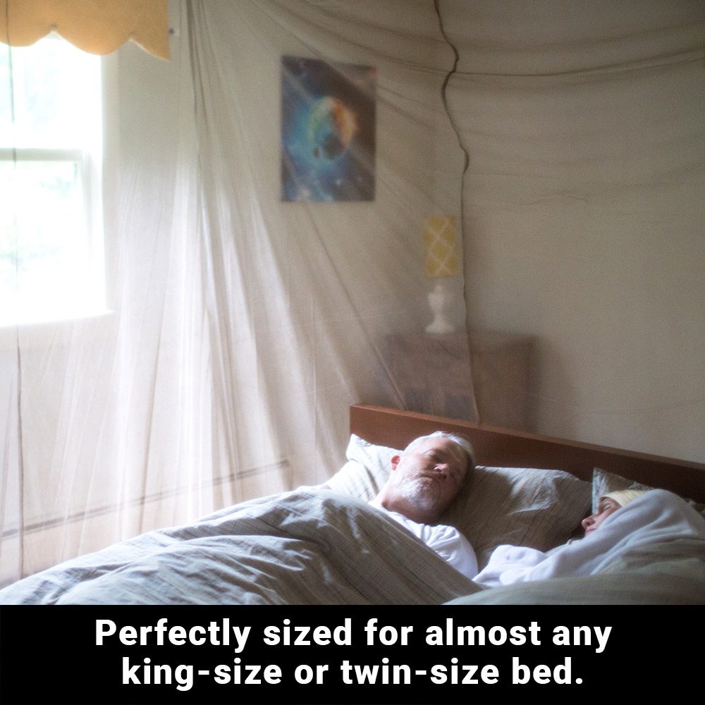 Shield Your Body SYB Faraday Bed Canopy inside a bedroom with a couple sleeping peacefully beneath the protective magnetic shield.