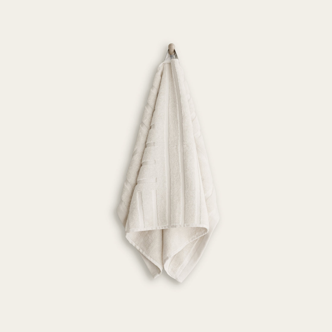 Italic Capri Australian Cotton Hand Towel, soft and absorbent home bath towel in neutral color, showcasing textured fabric and stitching.