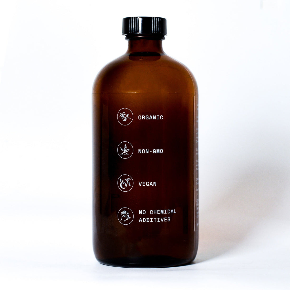 Pretty Farm Girl pure organic cold pressed castor oil bottle, hexane-free, shown in side view for natural skin and hair care.