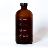 Pretty Farm Girl pure organic cold pressed castor oil bottle, hexane-free, shown in side view for natural skin and hair care.