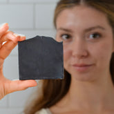Handmade charcoal and goat milk bar soap by Pretty Farm Girl, featuring a square shape and natural tallow ingredients.