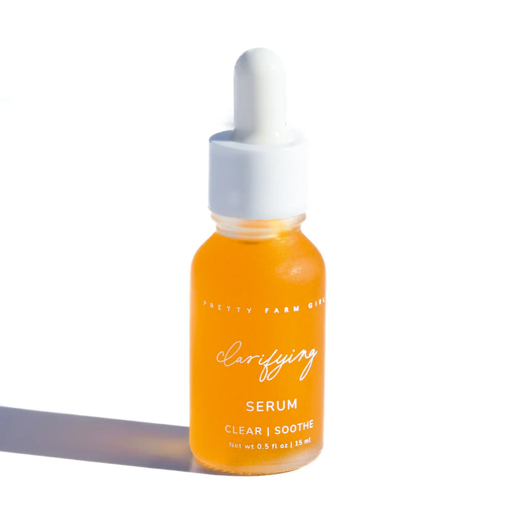 Pretty Farm Girl Clarifying Serum for Acne Prone Skin, clear glass bottle with dropper and serum inside.