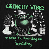 Yūjin Clothing Grinchy Vibes Christmas Hoodie featuring a festive Grinch design on a cozy holiday hoodie.