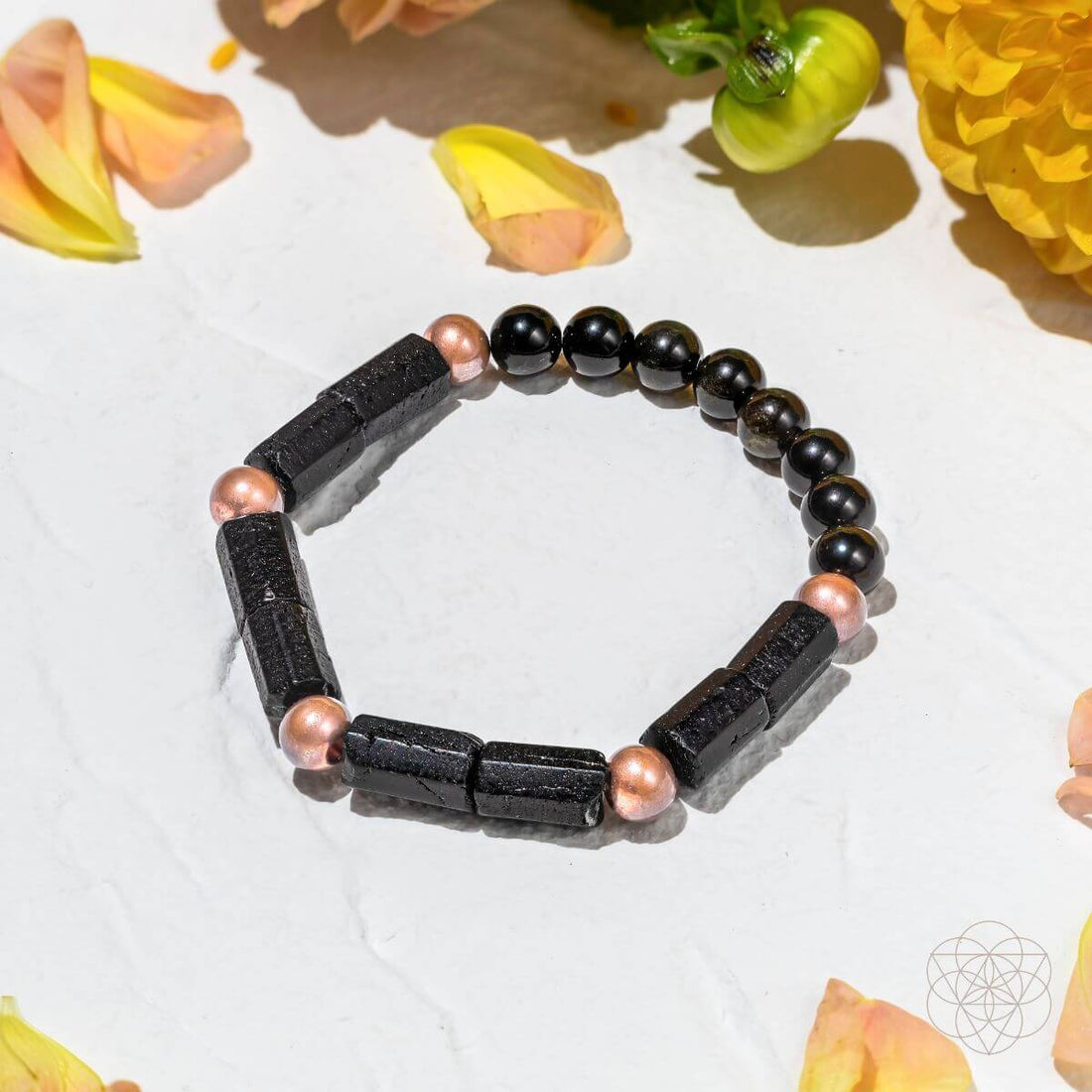 Copper bracelet of power from Conscious Items, "Born to Thrive" bracelet featuring a sleek, polished design with engraved details.