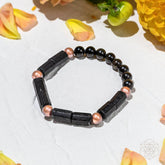 Copper bracelet of power from Conscious Items, "Born to Thrive" bracelet featuring a sleek, polished design with engraved details.