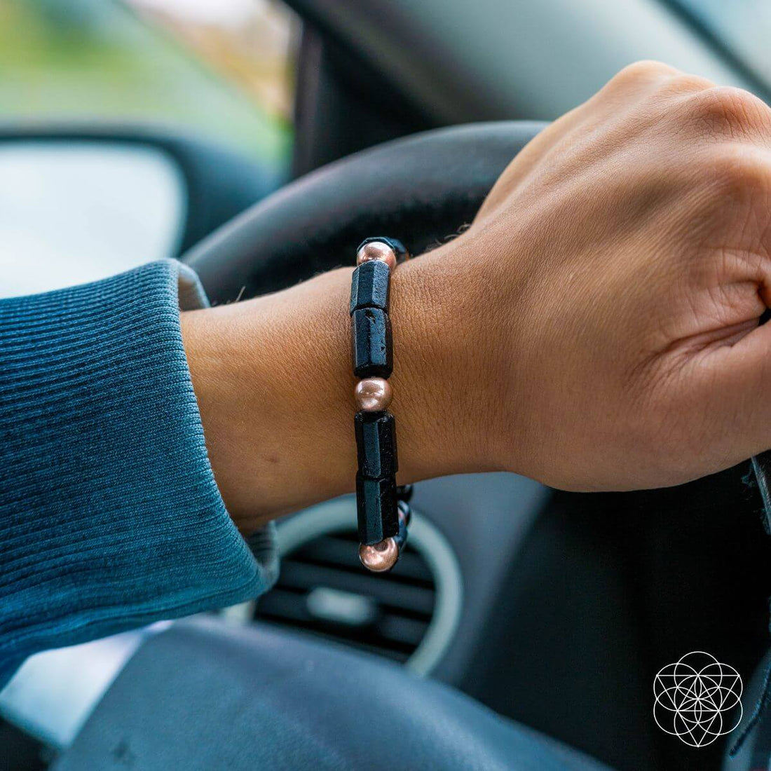 Copper bracelet from Conscious Items, "Born to Thrive" power bracelet, featuring a sleek design with engraved details.