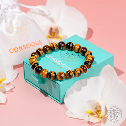 Conscious Items 7A grade Tiger’s Eye bracelet featuring polished beads and an adjustable cord, designed for style and energy.