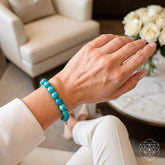Blue Amazonite bracelet with polished beads from the Empire of Her Own collection by Conscious Items, displayed on a neutral background.