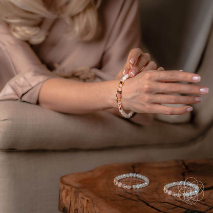 Conscious Items fertility bracelet featuring beads and charms designed to support fertility and wellness.