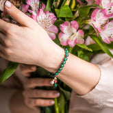 Conscious Items Law of Attraction bracelet featuring black beads and charm, designed to promote positive energy and manifestation.