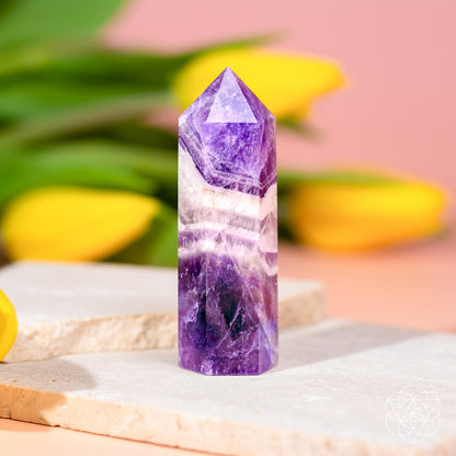 Chevron Amethyst Point of Transformation from Cycle Breaker by Conscious Items, featured as a striking home decor gemstone.