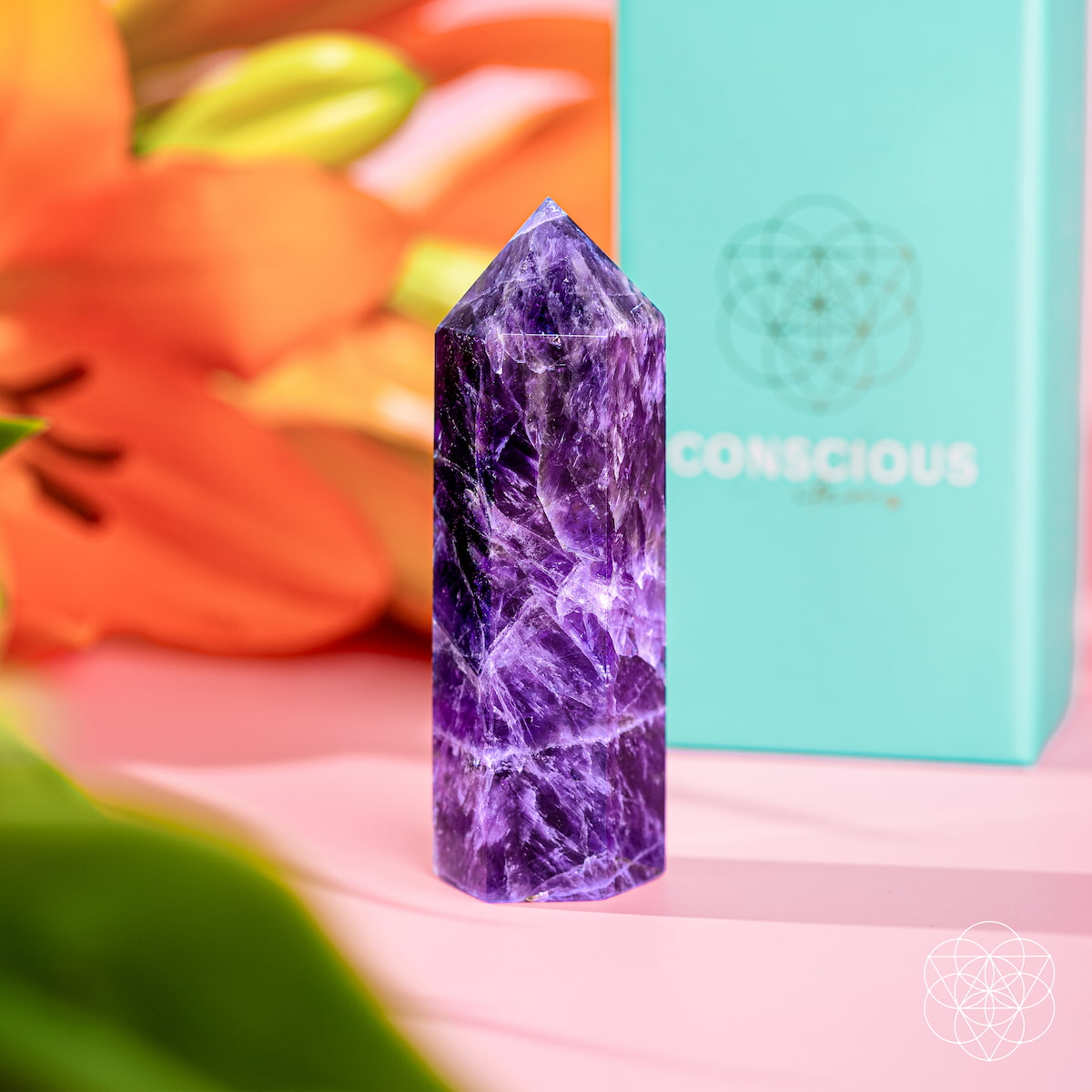 Chevron Amethyst Point of Transformation home decoration by Conscious Items, showcasing a polished purple and white crystal point.