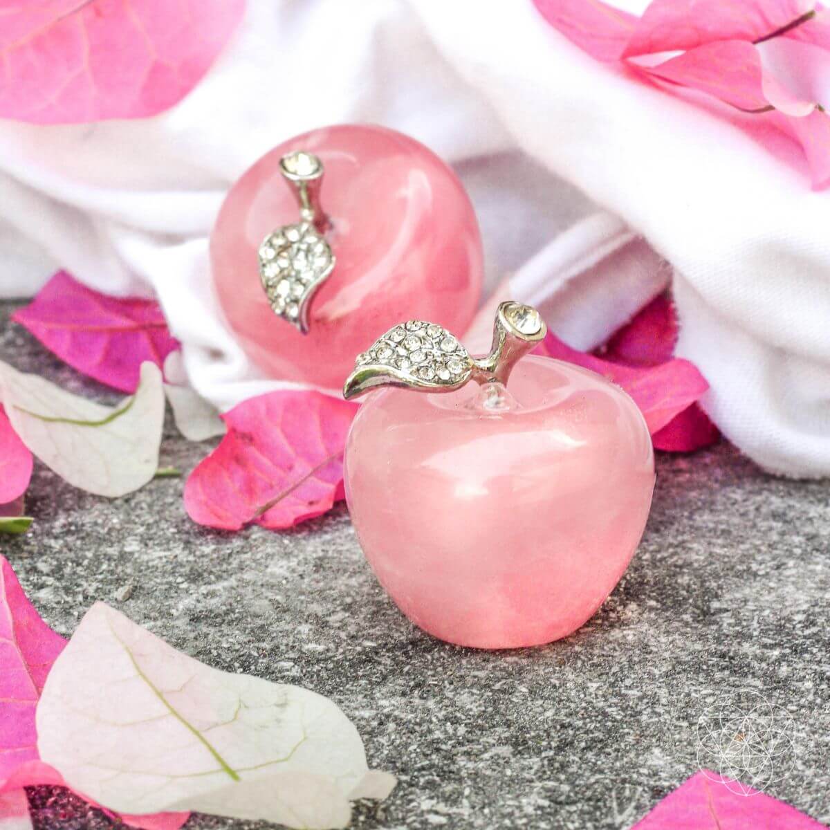 Pair of Rose Quartz Love Apples home decor by Conscious Items, smooth pink gemstone sculptures for positive energy and aesthetic appeal.