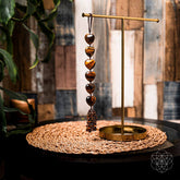 Home decoration tassel named The Protection Tassel by Conscious Items, featuring colorful woven threads and decorative tassel design.