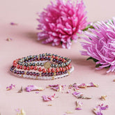 Set of four Prosperity Magnet Bracelets by Conscious Items, featuring black and silver jewelry with magnetic accents.