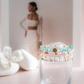Set of four Conscious Items stress-reliever jewelry bracelets with colorful beads and adjustable bands, designed for stress relief.