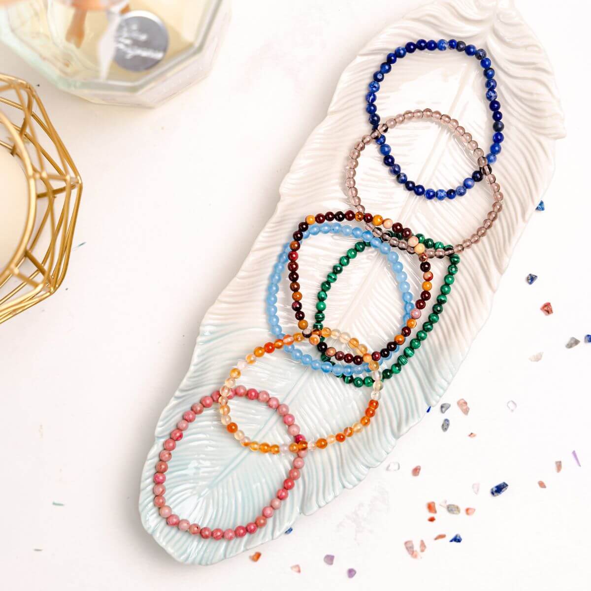 Set of chakra-balancing bracelets from Conscious Items, featuring colorful beads and natural gemstones for spiritual harmony.