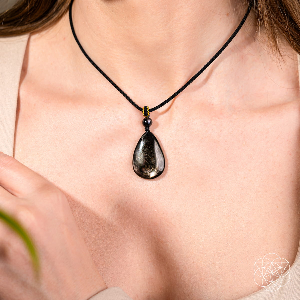Hypersthene Millionaire Manifestation Pendant necklace by Conscious Items featuring a polished Hypersthene stone on a silver chain.