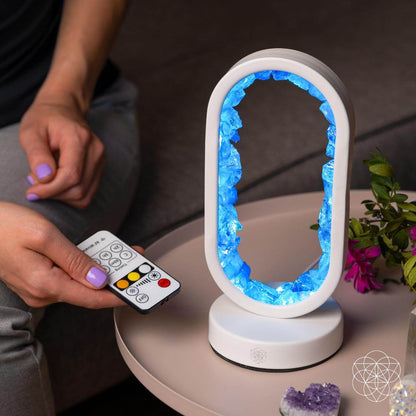 Clear quartz night light called Manifest Success by Conscious Items, designed as a lamp of achievement with a polished quartz stone.
