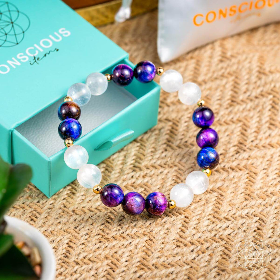 Galaxy Tiger’s Eye bracelet with cosmic energy amplifier design from Conscious Items, featuring polished tiger’s eye stones and cosmic accents.