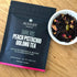 Four cups of Dark Iris Peach Pistachio Oolong Tea by August Uncommon Tea, showcasing the rich color and inviting presentation.