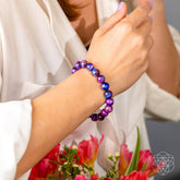 All-Galaxy Tiger’s Eye bracelet by Conscious Items featuring polished tiger’s eye beads on a stretch cord.
