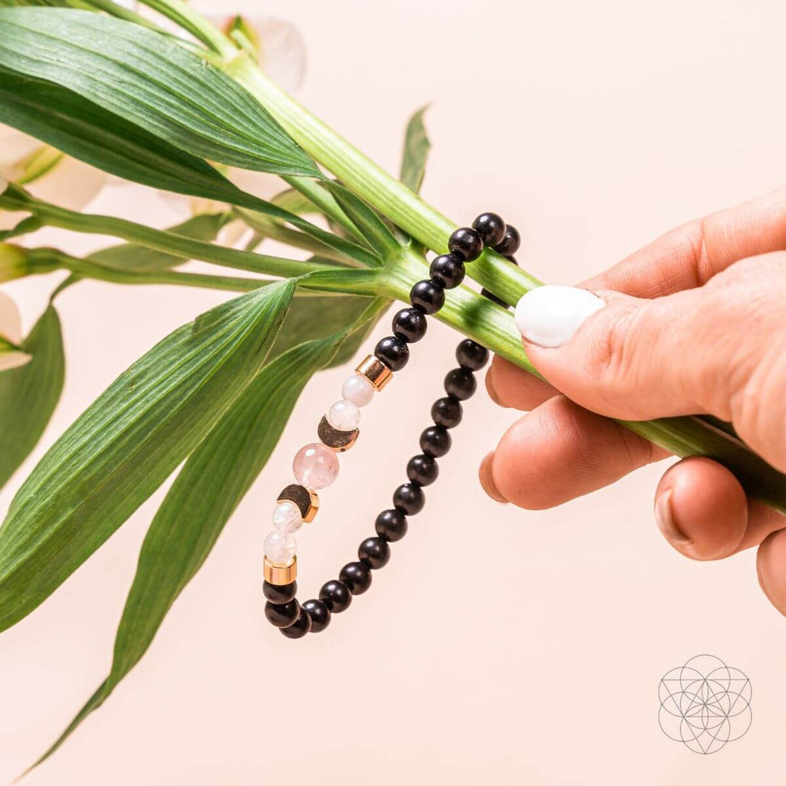 Shungite Super Charged Bracelet from Conscious Items featuring black stones on a stretch cord for digital detox and energy balancing.