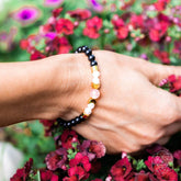 Conscious Items Digital Detox Shungite Super Charged Bracelet with black stones and elastic band for wellness and protection.
