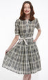 Dizzy-Lizzie Mrs Maisel black and beige wicker print dress displayed on a hanger, showcasing its stylish design and pattern.